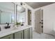 Bathroom with double sinks and modern fixtures, providing a functional and stylish space at 10703 Jordan Ct, Parker, CO 80134