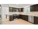 Modern kitchen featuring sleek countertops, stainless steel appliances, and custom cabinetry with ample counter space at 10703 Jordan Ct, Parker, CO 80134