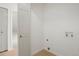 Bright laundry area offers extra storage and in-unit washer/dryer hookups at 10703 Jordan Ct, Parker, CO 80134