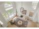 Inviting living room with large windows and soaring ceilings fills the home with natural light at 10703 Jordan Ct, Parker, CO 80134