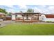 Backyard with outdoor deck, patio and an outbuilding at 6327 Fenton St, Arvada, CO 80003