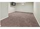 Basement area with carpet flooring, with a small window and television mount at 6327 Fenton St, Arvada, CO 80003