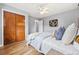 The bedroom features a ceiling fan, hardwood floors, and closet at 6327 Fenton St, Arvada, CO 80003