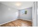This bedroom features hardwood floors, a window, and closet at 6327 Fenton St, Arvada, CO 80003