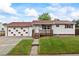 Charming single-story home with a cozy front porch and well-maintained lawn at 6327 Fenton St, Arvada, CO 80003