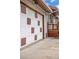Side view of a garage door with square designs, complemented by the home's architecture at 6327 Fenton St, Arvada, CO 80003