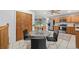 Kitchen features stainless steel appliances, lots of cabinet space, and a dining table at 6327 Fenton St, Arvada, CO 80003