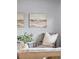 Close-up of a cozy chair, plants, and decorative artwork in a brightly lit living room at 6327 Fenton St, Arvada, CO 80003