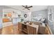 Open-concept living room flows into the kitchen, showcasing a modern and airy design at 6327 Fenton St, Arvada, CO 80003