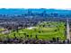 Gorgeous aerial view captures the vibrant Denver skyline and City Park golf course under a clear blue sky at 2023 E 20Th Ave, Denver, CO 80205