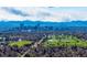 Scenic aerial view of city skyline, green spaces, and mountain backdrop at 2023 E 20Th Ave, Denver, CO 80205