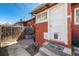 Cozy backyard with brick patio, privacy fence, and access to the home at 2023 E 20Th Ave, Denver, CO 80205