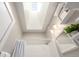 Bright bathroom featuring a shower, subway tile, and a skylight providing natural light at 2023 E 20Th Ave, Denver, CO 80205