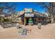 Commercial property with outdoor seating, colorful signage, and vibrant street presence at 2023 E 20Th Ave, Denver, CO 80205