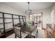 Elegant dining room showcasing a spacious table, hardwood floors, and stylish shelving for entertaining and dining at 2023 E 20Th Ave, Denver, CO 80205
