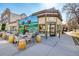 Charming restaurant exterior with outdoor seating and a colorful mural at 2023 E 20Th Ave, Denver, CO 80205