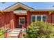 Charming brick home featuring a cozy front porch and landscaped entrance at 2023 E 20Th Ave, Denver, CO 80205