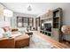 Bright living room featuring hardwood floors and a custom built-in media center at 2023 E 20Th Ave, Denver, CO 80205