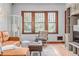 Cozy living room with hardwood floors and natural light from the window at 2023 E 20Th Ave, Denver, CO 80205
