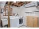 Basement laundry room with washer, dryer and storage at 3600 E Orchard Rd, Centennial, CO 80121