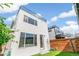 Modern home featuring a rooftop patio, back yard, and privacy fence at 3632 Lipan St, Denver, CO 80211