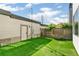 Backyard featuring artificial grass and a privacy fence at 3632 Lipan St, Denver, CO 80211