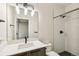 Bathroom featuring white countertops, sleek black fixtures, and a walk-in shower at 3632 Lipan St, Denver, CO 80211