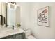 Modern half bathroom featuring stylish vanity, fixtures, and decor at 3632 Lipan St, Denver, CO 80211