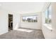 Spacious bedroom featuring large windows for natural light and an attached bathroom at 3632 Lipan St, Denver, CO 80211