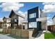 Modern two-story home featuring a sleek exterior and a well-maintained front yard with a wooden fence at 3632 Lipan St, Denver, CO 80211