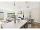 Bright living room featuring modern fireplace, hardwood floors, and stylish pendant lighting at 3632 Lipan St, Denver, CO 80211