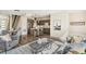 Spacious living room with modern decor, hardwood floors, and seamless transition to the kitchen and dining area at 3632 Lipan St, Denver, CO 80211