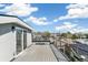 Enjoy city views from this home's roof deck with iron railings and a sliding glass door entry at 3632 Lipan St, Denver, CO 80211