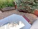 This view of the backyard deck offers great outdoor privacy with gravel landscaping and a white fence at 10517 Madison St, Thornton, CO 80233