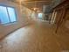 Unfinished basement space with exposed ceiling and natural light at 10517 Madison St, Thornton, CO 80233