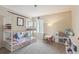 bedroom with bunk beds, play kitchen, and plush carpeting at 10517 Madison St, Thornton, CO 80233