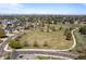 Wide aerial view of the neighborhood, featuring the park and residential area in the distance at 14447 Inca Ct, Westminster, CO 80023
