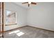 Bright bedroom featuring plush carpeting, a window, and neutral paint, ready for personalization at 14447 Inca Ct, Westminster, CO 80023