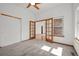 Comfortable bedroom boasting a ceiling fan, large window, and a closet for ample storage at 14447 Inca Ct, Westminster, CO 80023