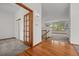 Inviting entryway with hardwood floors that lead into the spacious living area with ample natural light at 14447 Inca Ct, Westminster, CO 80023