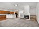 Bright and open living space featuring a fireplace, blending seamlessly into the modern kitchen area at 14447 Inca Ct, Westminster, CO 80023