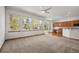 Expansive living area with large windows offering views and flowing into the updated kitchen space at 14447 Inca Ct, Westminster, CO 80023