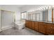 Main bathroom with dual sinks, granite countertop, soaking tub, and glass shower at 14447 Inca Ct, Westminster, CO 80023