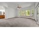 Bright main bedroom with many windows looking to backyard, and ensuite bath access at 14447 Inca Ct, Westminster, CO 80023