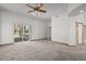 Large main bedroom features a glass slider to patio and easy access to ensuite bath at 14447 Inca Ct, Westminster, CO 80023