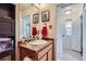 Bathroom featuring wood vanity with granite countertops, artwork, and decorative towels at 1199 Hummingbird Cir, Longmont, CO 80501
