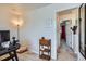 Bedroom area with an office space, desk, rolling chair and area rug at 1199 Hummingbird Cir, Longmont, CO 80501