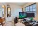 Bedroom with a large window with blinds and an office area at 1199 Hummingbird Cir, Longmont, CO 80501