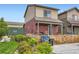 Quaint home with a fenced front yard and well-maintained landscaping at 1199 Hummingbird Cir, Longmont, CO 80501