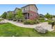 Charming two-story home with a welcoming front porch and beautiful landscaping at 1199 Hummingbird Cir, Longmont, CO 80501